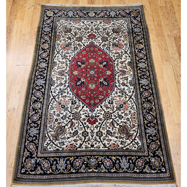 "This vintage Persian Qum area rug, hand-knotted in the second quarter of the 20th century, is a distinguished example of...