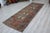 This gorgeous hand knotted Vintage Anatolian runner rug is approximately 60 years old in excellent vintage condition. The...