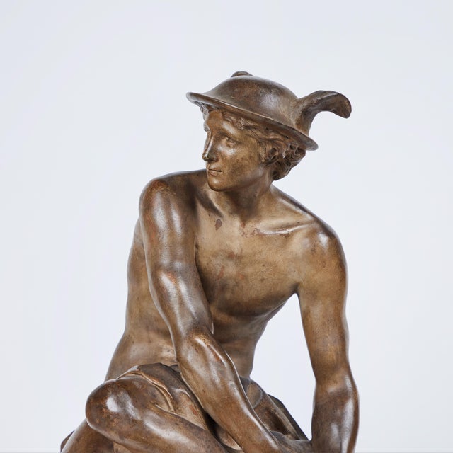A classic terra cotta sculpture of Mercury signed Jean-Baptiste Pigalle (1714-1785).