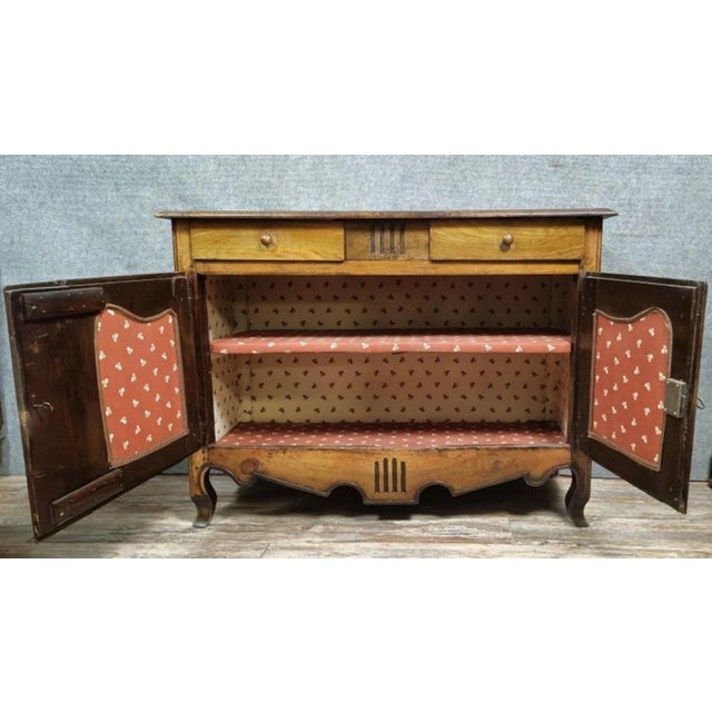 Louis xv period buffet in solid walnut and oak, circa 1750 front opening with two doors and two drawers scalloped lower...