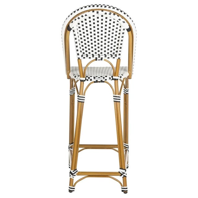 The beloved European bistro chair assumes a coastal update in this black and white bar stool. The cheerfully woven PE...