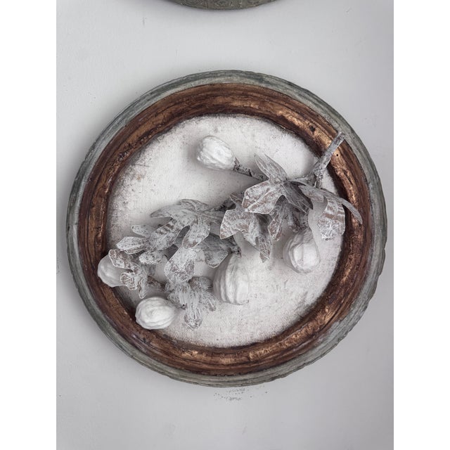“Aurelia” Paper Mache and Plaster Fig Branch in Cartapesta Round Frame. Add elegance and texture to your space with this...