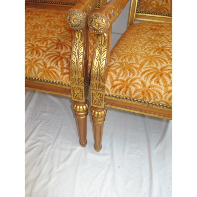 Beautiful pair of honey stained Isenhour chairs with gilded accents, carvings and nailhead trim. Chairs have original...