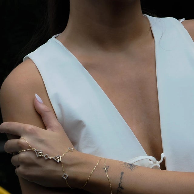 Diamond Triangle Gold Vermeil Fashion Hand Bracelet is a unique and stylish accessory designed for those who love to stand...