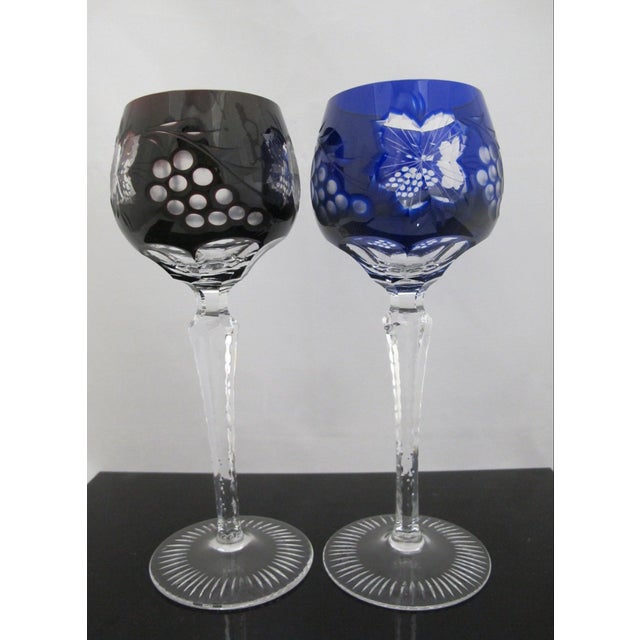 Pair of vintage Bohemian hock wine glasses. Cut-to-clear layer that reveals intricate flowers, grape clusters and vine...