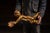 Whimsical figural hanging light modeled as a flying cherub suspended horizontally from a short length of chain, arms...