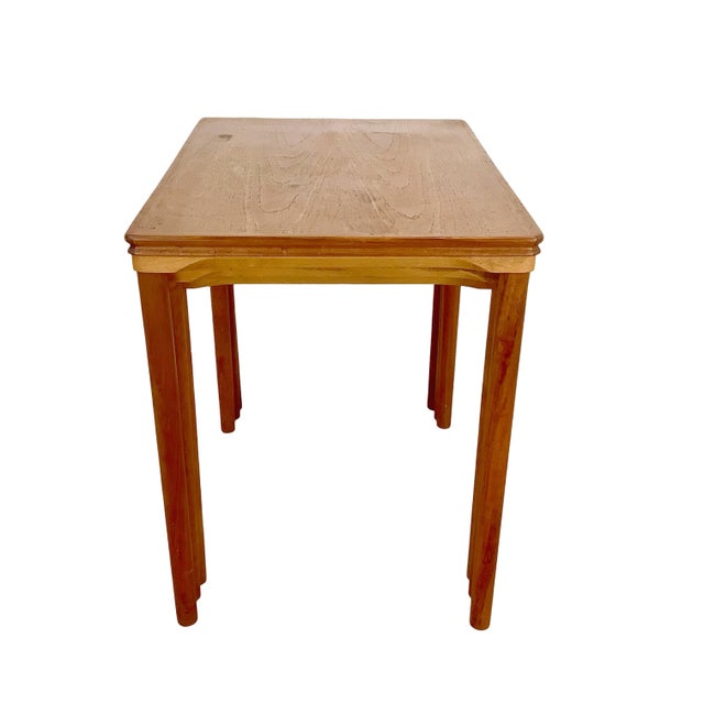 A striking set of three vintage teak nesting tables by Danish manufacturer Toften Møbelfabrikken. Designed with the clean...