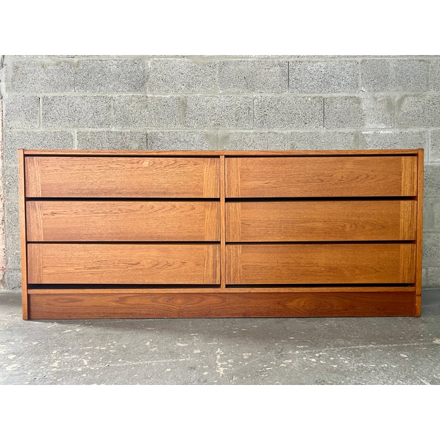 Vintage 1980s Danish Modern Teak Double Dresser. Features a quintessential Mid-Century Modern Scandinavian Design, with...