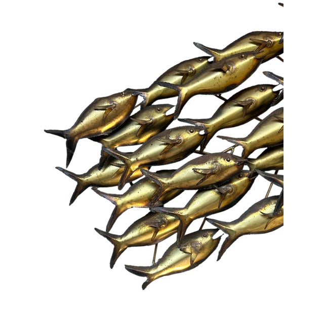 Unsigned brass brutalist wall sculpture of a school of fish- wall mounts very easily. Measures 37” X 13” X 4 1/2” d.