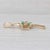 Gemstone Information: - Natural Emeralds - Total Carats - 0.12ctw Cut - Baguette Color - Green Treatment - Oiling -...