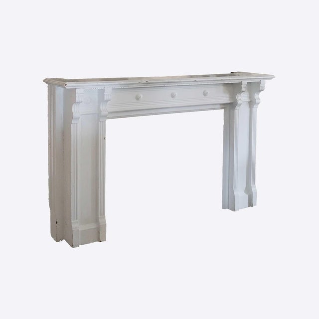Antique white painted Victorian fireplace mantel. Opening Dimensions:W:41.5" x H:35". Originally shellacked and recently...