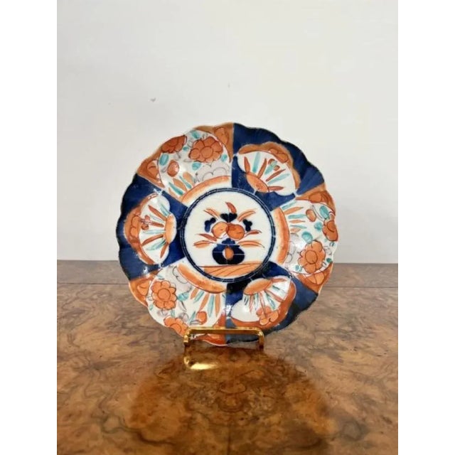 Pair of quality antique Japanese imari plates having a quality pair of antique Japanese imari plates with scallop shaped...