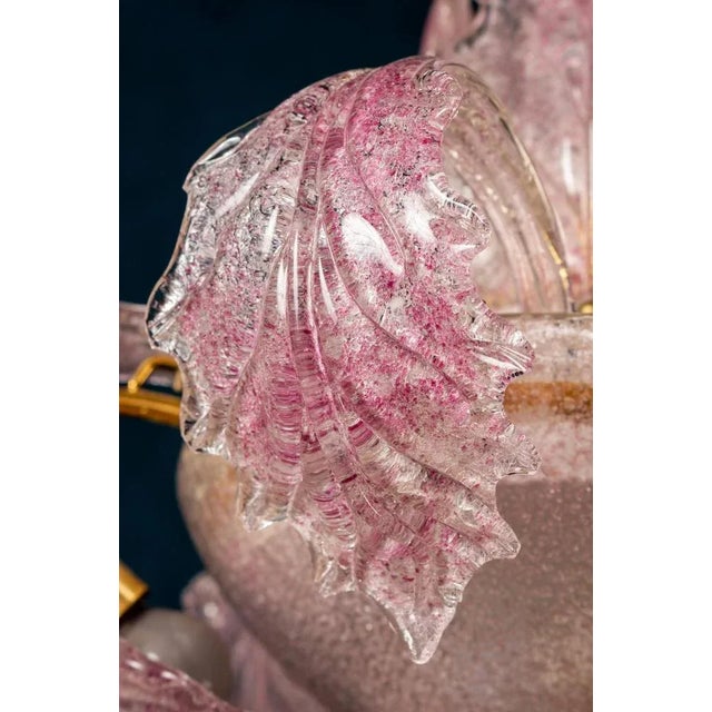 Charming Pink hand blown Murano glass chandelier. Excellent vintage condition. 6 E 14 light bulbs. This piece is...