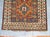 A late 19th century Caucasian Kazak rug stitched onto a light blue Turkish Kilim.