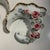 This item is a set of vintage porcelain cornucopia wall pocket vases decorated with applied pink roses, green leaves,...