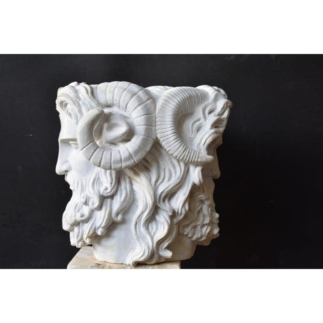 An elegant and finely carved marble bust depicting Janus, the Roman god of transitions, time, and duality. This 20th-...