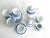 Bright white porcelain tea set with blue band made and designed by Costa Verde in Portugal. Set includes teapot, creamer,...