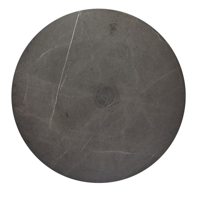 The mid-century inspired breakfast table in Honed Grigio Armani interlocking marble draws from the mid- 20th century's...