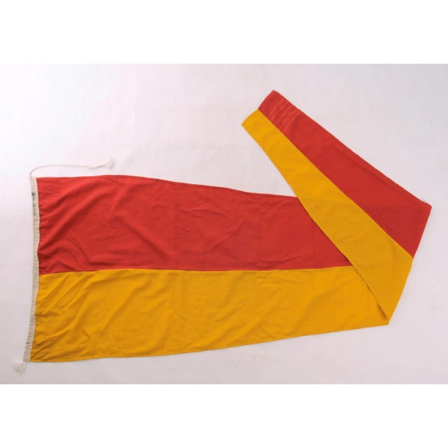 Circa 1980s almost 9' red and yellow linen nautical signal flag number 7. Flag has some discolorations and stains from...