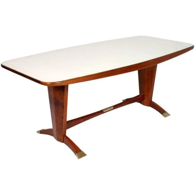 This dining room set from Cantù consists of one table with six chairs and is in the manner of Melchiorre Bega. The set...