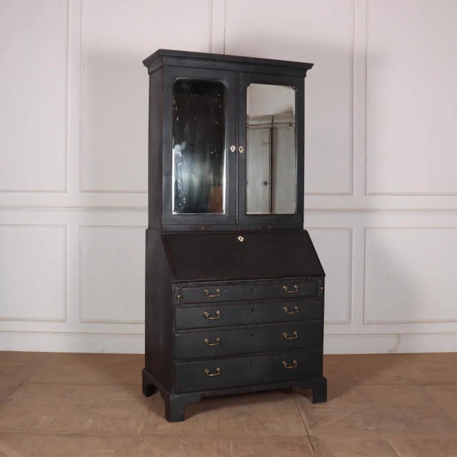 18th C English painted oak bureau bookcase with a mirrrored top. 1770. Height to desk is 30.5". This piece is designed in...