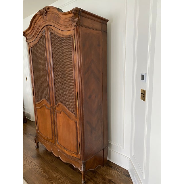 Antique French Armoire. Sturdy and ornate - intricate carving along top/crown and front edge of legs....condition...