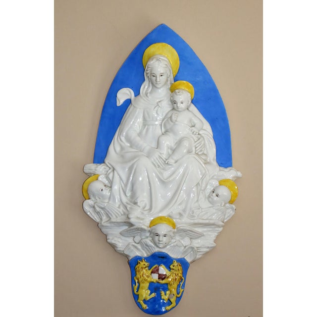 A beautiful religious porcelain relief of a Madonna with angels.