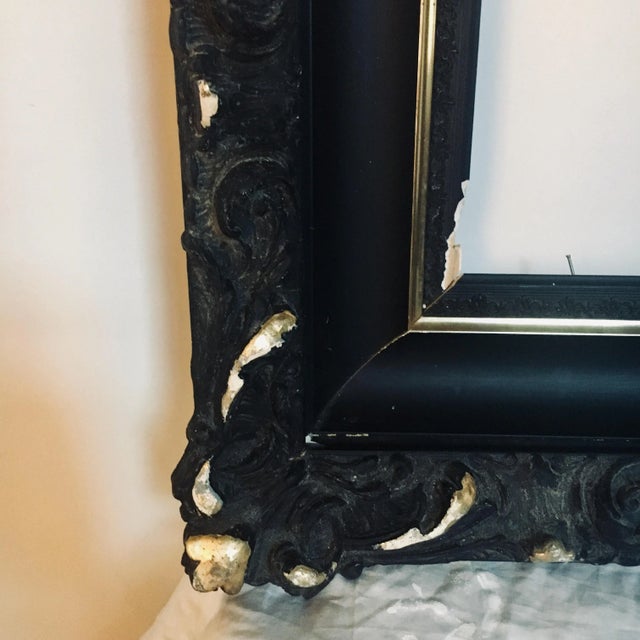 A heavily modeled circa 1880 black and gold, Gothic Victorian frame. Please note, (repairable) damage on the bottom left...