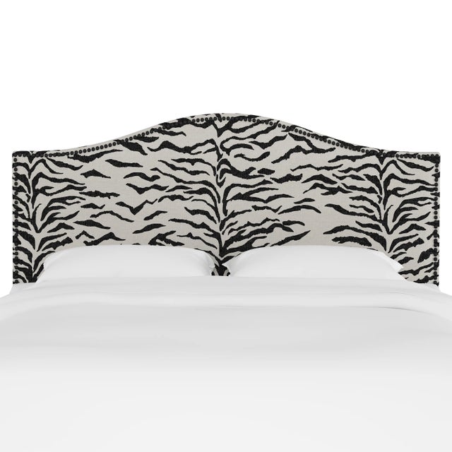 Give your interior a lift with the Headboard. Featuring the delicate curves of a classic camelback design, with subtle...