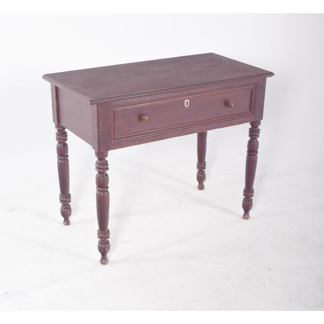 Romantic desk/table with drawer. with two round handles and a central lock, it's a functional piece for storing small...
