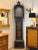 An 18th century English longcase clock with chinoiserie decoration on a black lacquer ground, featuring gilt figures,...