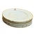A quietly luxurious set of Limoges porcelain plates, defined by their pure white ground and refined restraint. The...