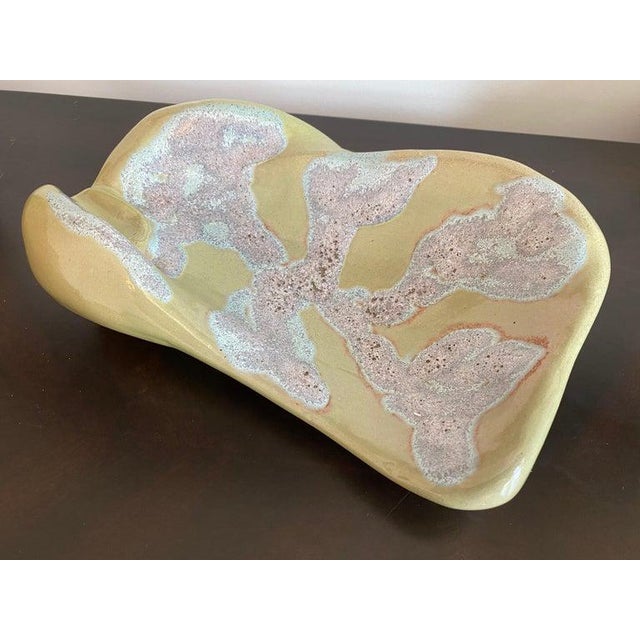 A wonderful example of famed American potter, Mariana van Allesch’s 1940 asymmetrical modern pottery. Done in subdued...