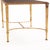 The rectangular glass top features a refined reverse-painted inset surface set within a gilt-iron frame, supported by...