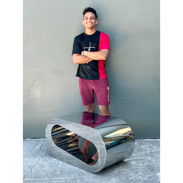 Elevate your living space with this striking vintage Italian polished chrome coffee table. A quintessential example of...