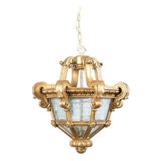 Early 20th Century French Baroque Style Giltwood Lantern with Carved Volutes and Textured Glass For Sale