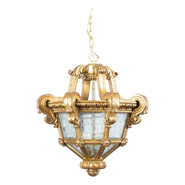 Early 20th Century French Baroque Style Giltwood Lantern with Carved Volutes and Textured Glass For Sale