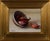 This artwork depicts a small bowl of spilled shallots, their rich, reddish-brown skins contrasting beautifully against a...