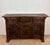 Striking Spanish sideboard cabinet crafted in solid oak, featuring rich hand-carved decoration throughout the façade. The...