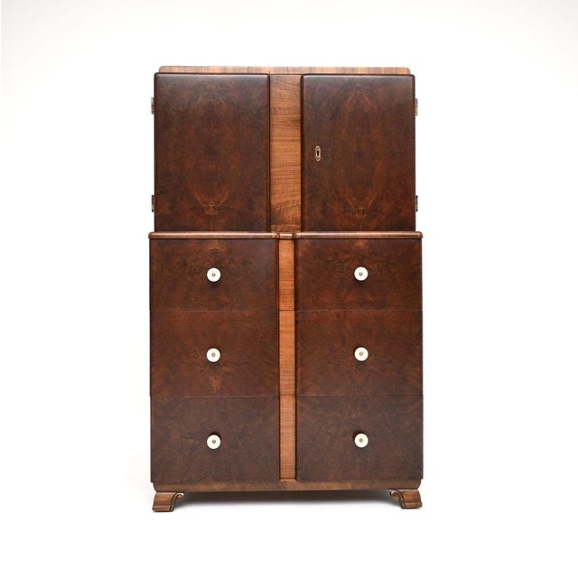 An absolutely stunning French Art Deco burr walnut cabinet on chest. This was made in France, it dates from the 1930’s. It...