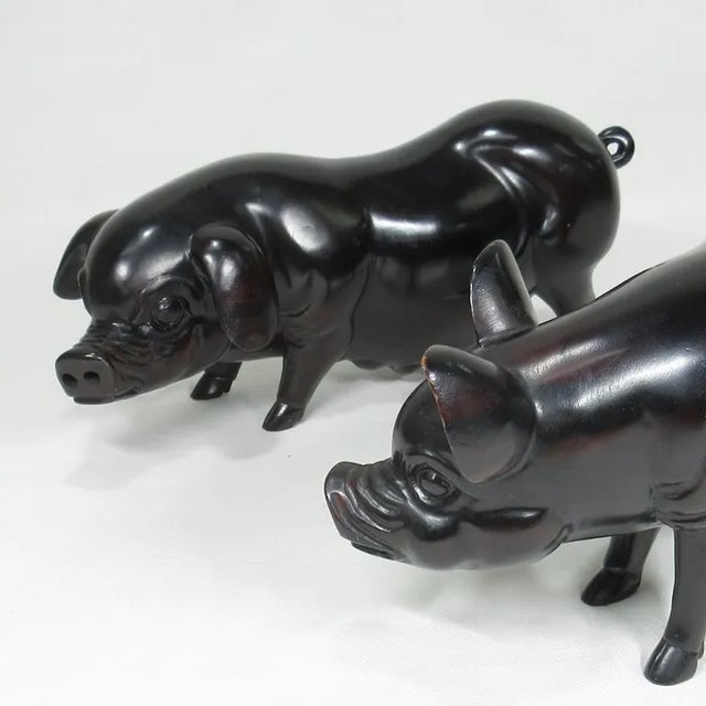 A charming pair of standing pigs from Japan. Carved from hardwood, this animated and detailed couple would make a charming...