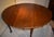 English oval top walnut dining table of the 1700s , in the Queen Anne style. The turned legs terminate in a powerful...