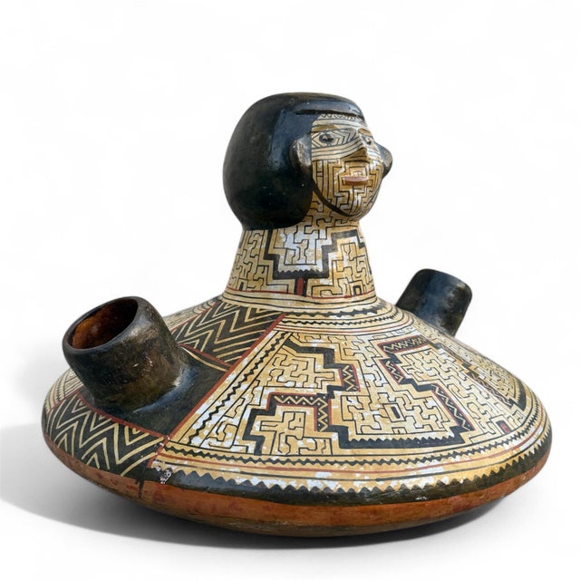 A wonderful old and large traditional vessel with the hallmark geometric design of the Shipibo-Conibo people. The small...