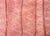A vintage late 20th century Tibetan hand-knotted runner with a horizontal stripe pattern woven in varying shades of reds,...