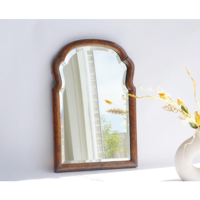 Antique arched scalloped mirror with a nice frame made out of walnut and beveled glass. The mirror is made in the...