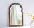 Antique arched scalloped mirror with a nice frame made out of walnut and beveled glass. The mirror is made in the...