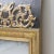 A gilded mirror around 1850/1860. It is a wooden mirror with a richly decorated decor. The lyre in the motif with arches...