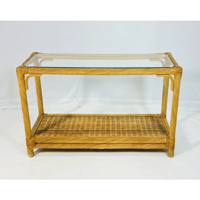 Beautiful console table designed and manufactured in the United States in the 1960s. The table is made out of pencil thin...