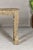A Mughal style painted console table with carved apron and legs. This Mughal style painted console table captivates with...