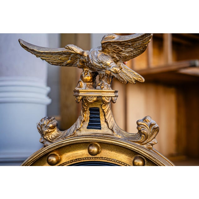 Home Inspirations Auctions is pleased to offer this Federal Convex mirror in a striking gold and black button frame.